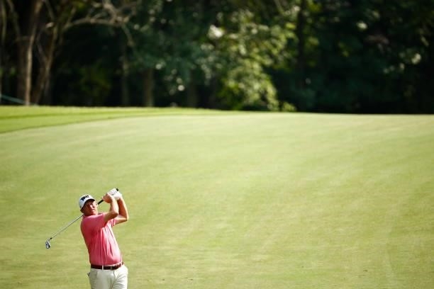 Jim Herman of the United States plays an approach shot on the 14th hole during the first round of the Wyndham Championship at Sedgefield Country Club...
