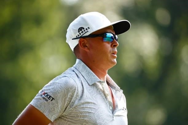 Rickie Fowler of the United States walks off of the 15th tee during the first round of the Wyndham Championship at Sedgefield Country Club on August...
