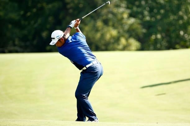 Hideki Matsuyama of Japan plays a second shot on the 14th hole during the first round of the Wyndham Championship at Sedgefield Country Club on...