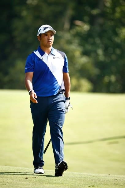 Hideki Matsuyama of Japan walks the 14th hole during the first round of the Wyndham Championship at Sedgefield Country Club on August 12, 2021 in...