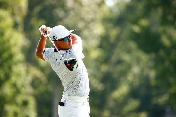 Rickie Fowler of the United States plays his shot from the 15th tee during the first round of the Wyndham Championship at Sedgefield Country Club on...