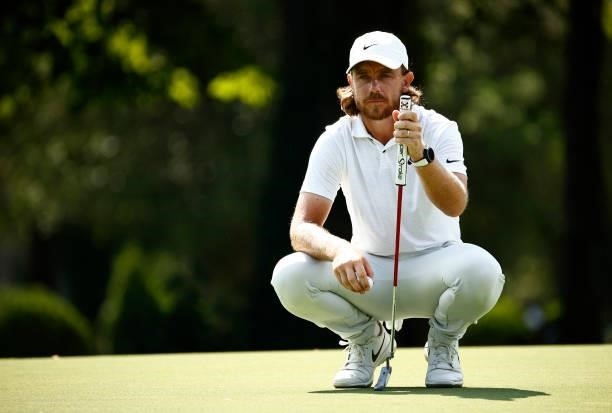 Tommy Fleetwood of England lines up a putt on the 14th green during the first round of the Wyndham Championship at Sedgefield Country Club on August...