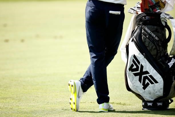 Detailed view of shoes and a golf bag belonging to Wyndham Clark of the United States are seen as he waits on the 14th hole during the first round of...