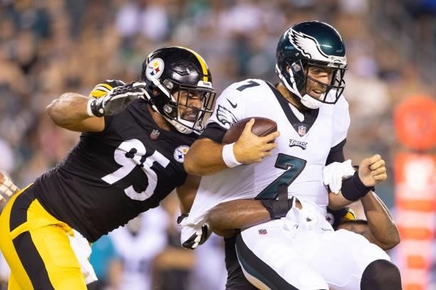 Joe Flacco of the Philadelphia Eagles gets sacked by Chris Wormley and Jamir Jones of the Pittsburgh Steelers in the second quarter of the preseason...