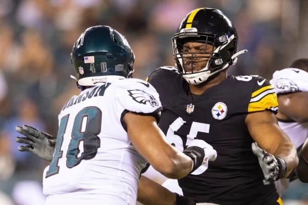 Dan Moore Jr. #65 of the Pittsburgh Steelers blocks Patrick Johnson of the Philadelphia Eagles during the preseason game at Lincoln Financial Field...