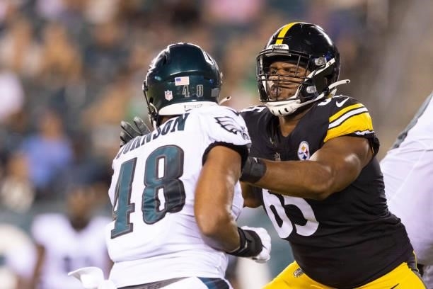 Dan Moore Jr. #65 of the Pittsburgh Steelers blocks Patrick Johnson of the Philadelphia Eagles during the preseason game at Lincoln Financial Field...