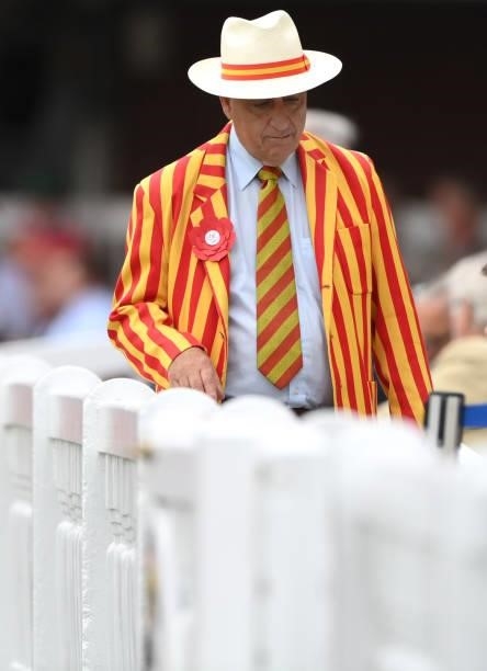 An MCC member wearing a red rosette on Ruth Strauss Foundation Day during day two of the Second Test Match between England and India at Lord's...