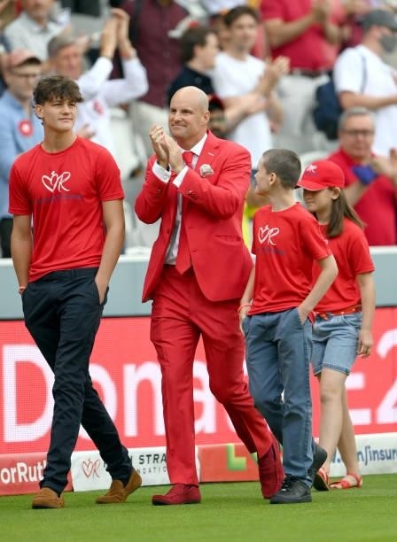 Andrew Strauss walks around the outfield with his two sons on Ruth Strauss Foundation Day during day two of the Second Test Match between England and...