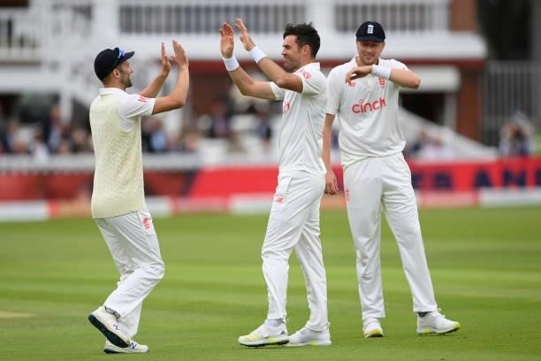 Jimmy Anderson of England celebrates with Mark Wood and Ollie Robinson after dismissing Ajinkya Rahane of India during the Second LV= Insurance Test...
