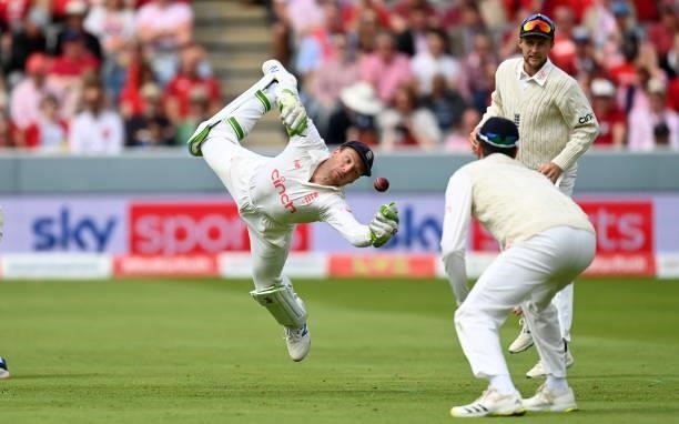 England wicketkeeper Jos Buttler dives for the ball during day two of the Second LV= Insurance Test Match between England and India at Lord's Cricket...