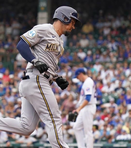 Jace Peterson of the Milwaukee Brewers hits a two-run home run against the Chicago Cubs at Wrigley Field on August 12, 2021 in Chicago, Illinois.