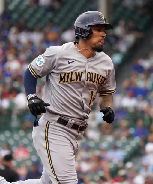 Jace Peterson of the Milwaukee Brewers hits a two-run home run against the Chicago Cubs at Wrigley Field on August 12, 2021 in Chicago, Illinois.