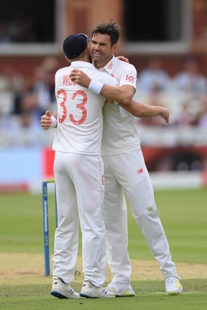 Jimmy Anderson of England celebrates with Mark Wood after taking his 5th wicket to dismiss Mohammed Siraj of India during the Second LV= Insurance...