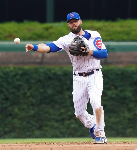 David Bote of the Chicago Cubs throws to first during a game against the Milwaukee Brewers at Wrigley Field on August 12, 2021 in Chicago, Illinois.