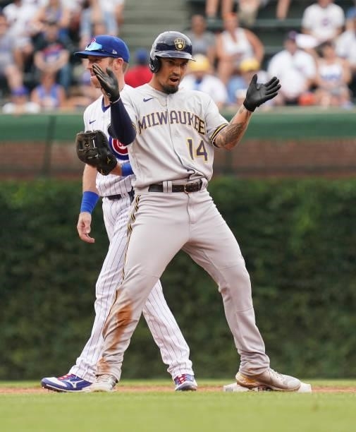 Jace Peterson of the Milwaukee Brewers reacts after a double during a game against the Chicago Cubs at Wrigley Field on August 12, 2021 in Chicago,...
