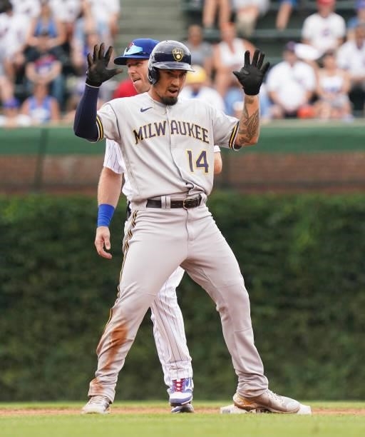 Jace Peterson of the Milwaukee Brewers reacts after a double during a game against the Chicago Cubs at Wrigley Field on August 12, 2021 in Chicago,...