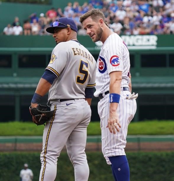 Patrick Wisdom of the Chicago Cubs reacts after getting to first base on an error during the third inning of a game against the Milwaukee Brewers at...