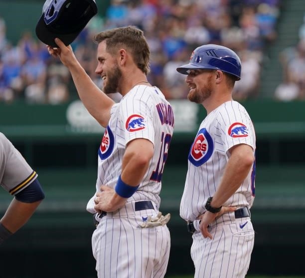 Patrick Wisdom of the Chicago Cubs reacts after getting to first base on an error during the third inning of a game against the Milwaukee Brewers at...