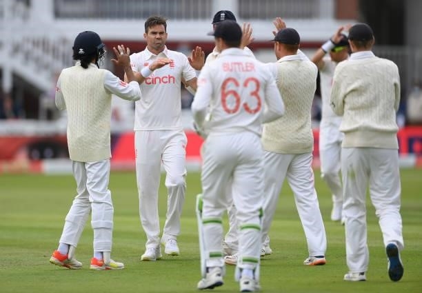 Jimmy Anderson of England celebrates with team mates after taking his 5th wicket to dismiss Mohammed Siraj of India during the Second LV= Insurance...