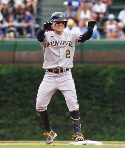 Luis Urias of the Milwaukee Brewers reacts after his double during the fifth inning of a game against the Chicago Cubs at Wrigley Field on August 12,...