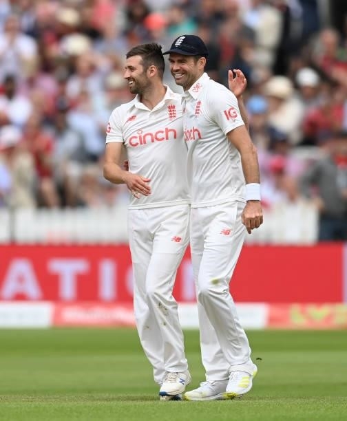 James Anderson of England celebrates with Mark Wood after catching out Ravindra Jadeja of India during day two of the Second LV= Insurance Test Match...