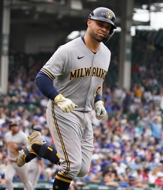 Manny Pina of the Milwaukee Brewers hits a grand slam during the fifth inning of a game against the Chicago Cubs at Wrigley Field on August 12, 2021...
