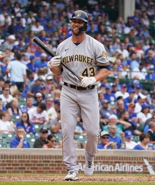 Hunter Strickland of the Milwaukee Brewers reacts after striking out during the fifth inning of a game against the Chicago Cubs at Wrigley Field on...