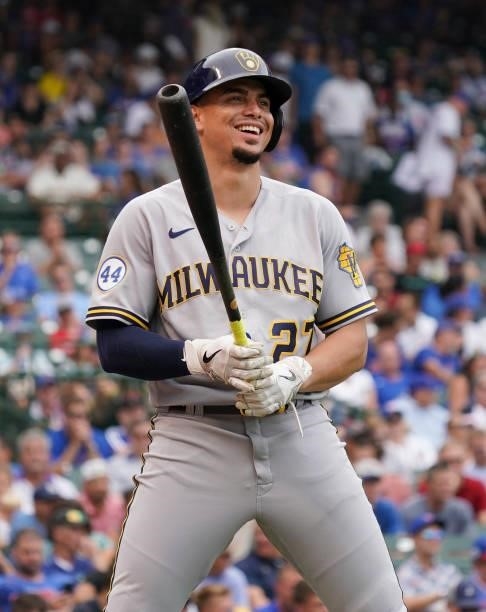 Willy Adames of the Milwaukee Brewers loosens up between innings during a game against the Chicago Cubs at Wrigley Field on August 12, 2021 in...
