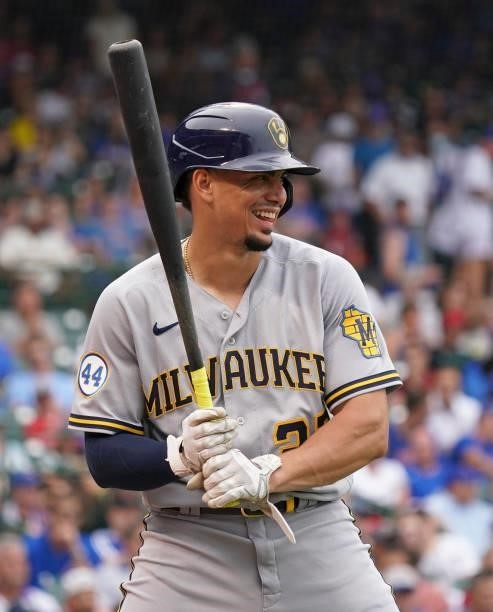 Willy Adames of the Milwaukee Brewers loosens up between innings during a game against the Chicago Cubs at Wrigley Field on August 12, 2021 in...