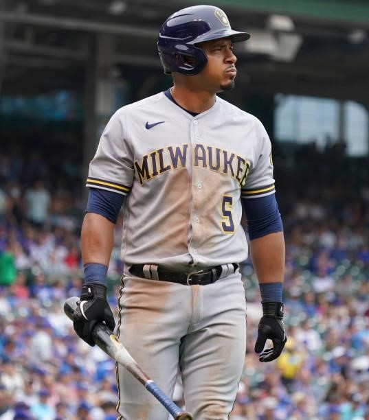 Eduardo Escobar of the Milwaukee Brewers reacts after striking out during the sixth inning of a game against the Chicago Cubs at Wrigley Field on...