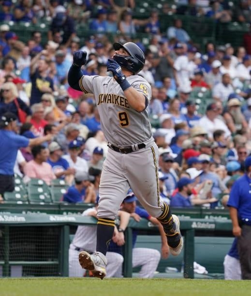 Manny Pina of the Milwaukee Brewers celebrates a two-run home run during the sixth inning of a game against the Chicago Cubs at Wrigley Field on...