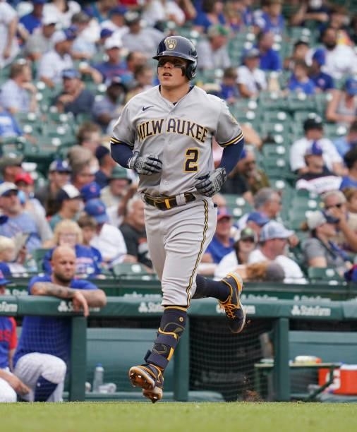 Luis Urias of the Milwaukee Brewers hits a two-run home run during the seventh inning of a game against the Chicago Cubs at Wrigley Field on August...