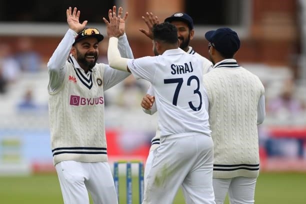 Mohammed Siraj of India celebrates with Virat Kohli after dismissing Dominic Sibley of England during the Second LV= Insurance Test Match: Day Two...
