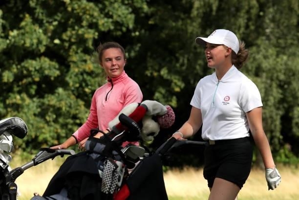 Beth Coulter of Kirkistown Castle and Maggie Whitehead of Close House chat as they walk down the 17th during their semi-final match on day four of...