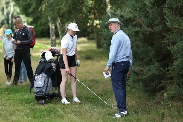 Maggie Whitehead of Close House receives a ruling from a R&A official during her semi-final match on day four of the R&A Girls Amateur Championship...