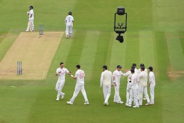 Jimmy Anderson of England celebrates with team mates after dismissing Ajinkya Rahane of India during the Second LV= Insurance Test Match: Day Two...