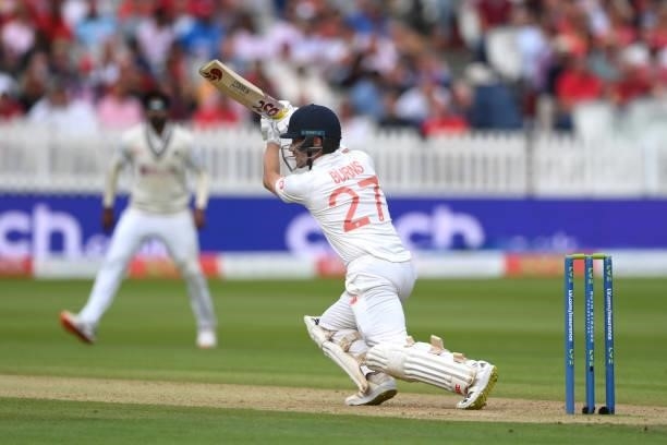 England batsman Rory Burns drives to the boundary on Ruth Strauss Foundation Day during day two of the Second Test Match between England and India at...