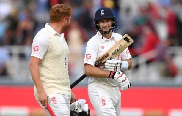 England batsmen Joe Root 9r) and Jonny Bairstow share a joke as they leave the field at close of play on Ruth Strauss Foundation Day during day two...