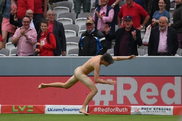 Streaker takes a tumble at the end of play during the Second LV= Insurance Test Match: Day Two between England and India at Lord's Cricket Ground on...