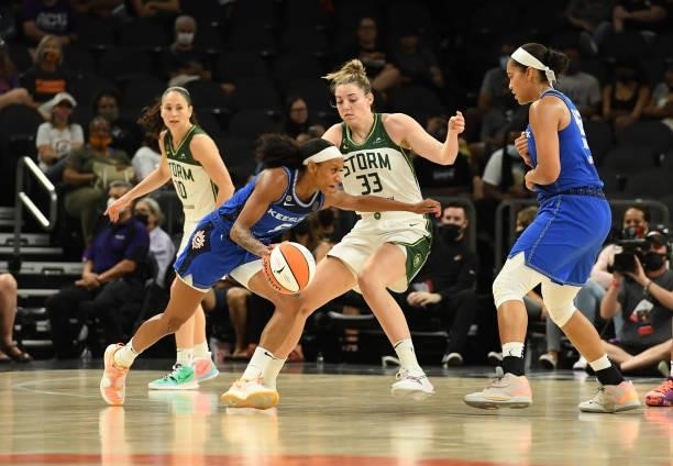 Jasmine Thomas of the Connecticut Sun drives to the basket while being defended by Katie Lou Samuelson of the Seattle Storm during the 2021...