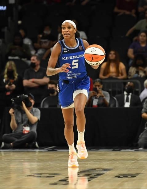 Jasmine Thomas of the Connecticut Sun brings the ball up court against the Seattle Storm during the 2021 Commissioner's Cup Championship Game at...
