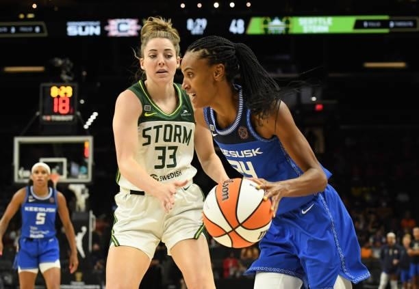 DeWanna Bonner of the Connecticut Sun drives to the basket while being defended by Katie Lou Samuelson of the Seattle Storm during the 2021...