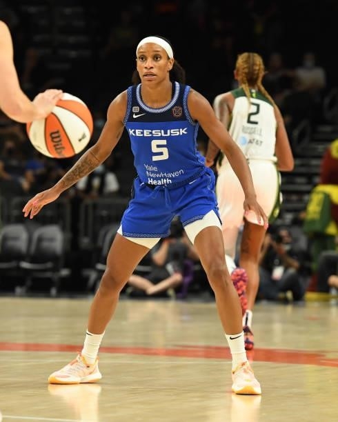 Jasmine Thomas of the Connecticut Sun defends against the Seattle Storm during the 2021 Commissioner's Cup Championship Game at Footprint Center on...