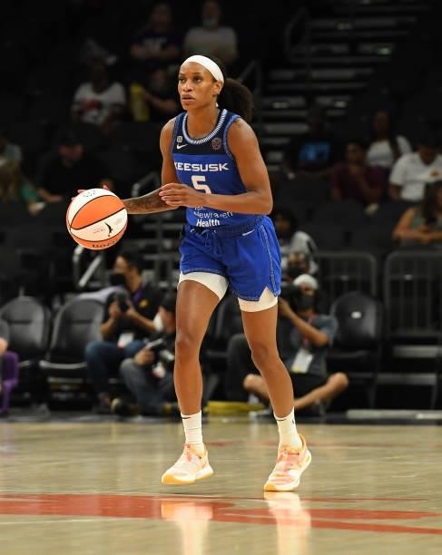 Jasmine Thomas of the Connecticut Sun brings the ball up court against the Seattle Storm during the 2021 Commissioner's Cup Championship Game at...