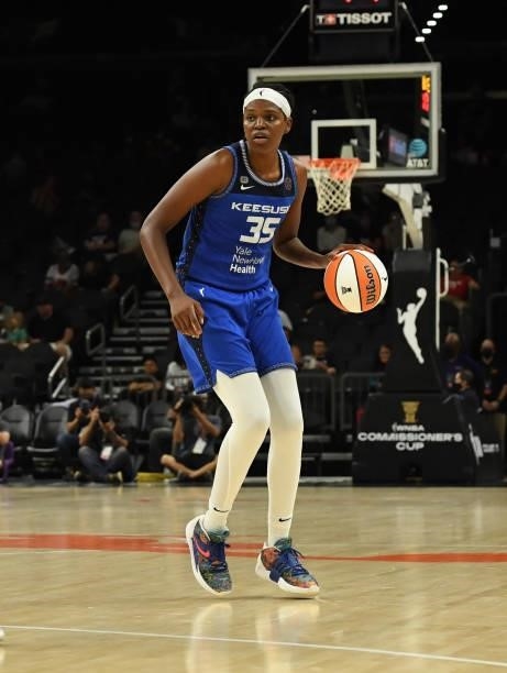 Jonquel Jones of the Connecticut Sun brings the ball up court against the Seattle Storm during the 2021 Commissioner's Cup Championship Game at...