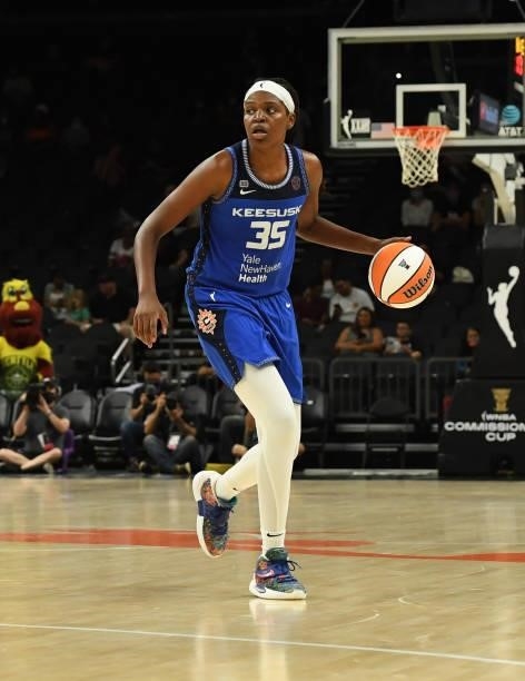 Jonquel Jones of the Connecticut Sun brings the ball up court against the Seattle Storm during the 2021 Commissioner's Cup Championship Game at...