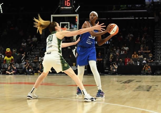 Jonquel Jones of the Connecticut Sun looks to pass the ball while being defended by Breanna Stewart of the Seattle Storm during the 2021...