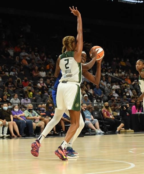 Jonquel Jones of the Connecticut Sun looks to take a jump shot while being defended Mercedes Russel of the Seattle Storm during the second half of...