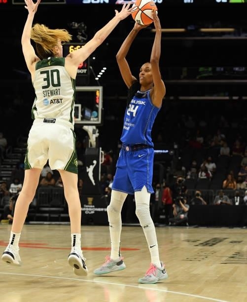 DeWanna Bonner of the Connecticut Sun looks to pass the ball while being defended by Breanna Stewart of the Seattle Storm during the 2021...