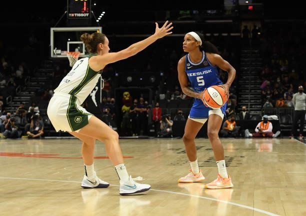 Jasmine Thomas of the Connecticut Sun looks to pass the ball while being defended by Stephanie Talbot of the Seattle Storm during the 2021...